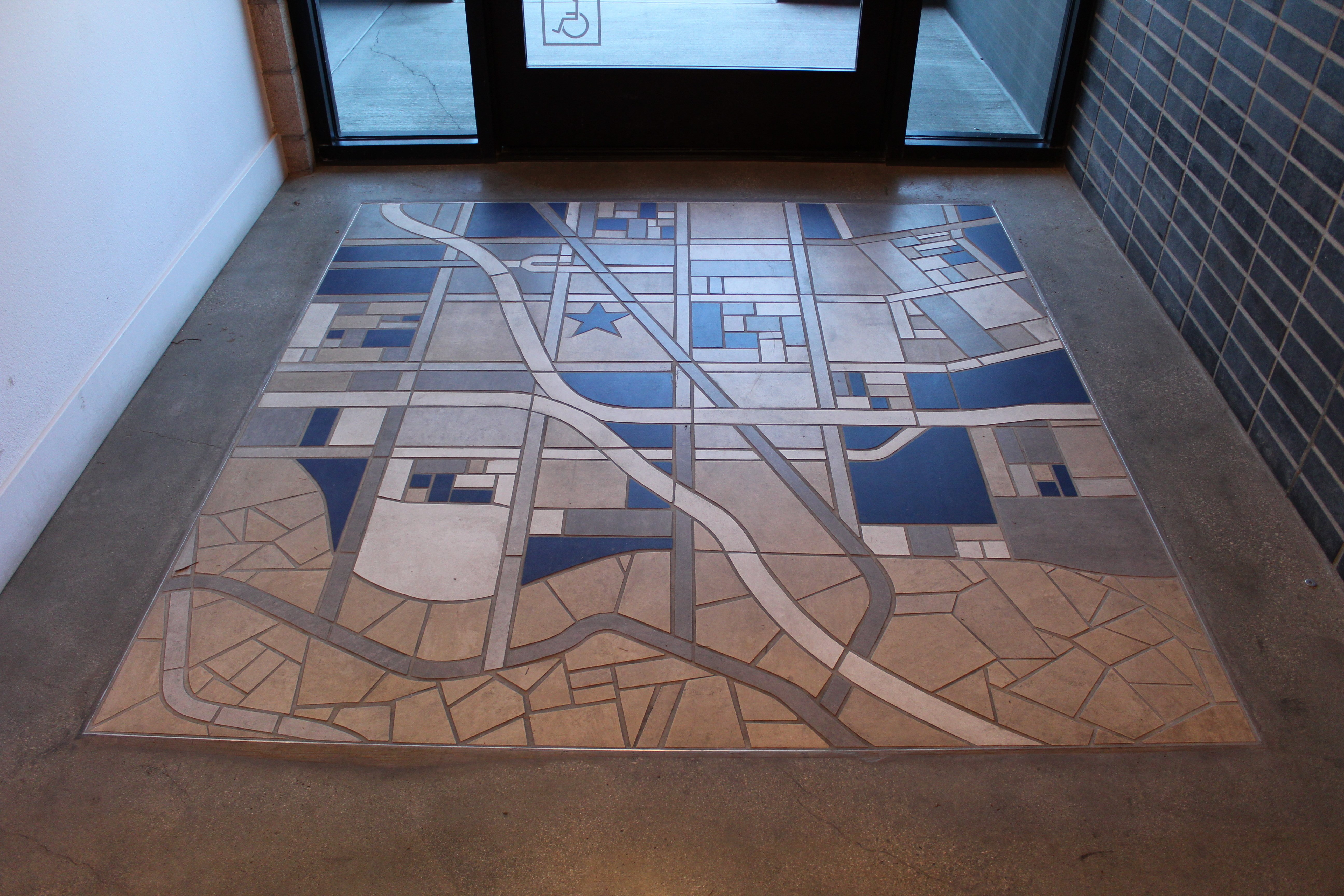 Completed mural in the entryway of the Otsego Apartments.